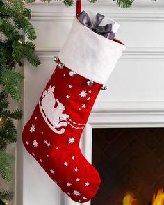 a christmas stocking hanging from a fireplace