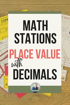 a pile of math stations on top of a wooden table with the words, place value with