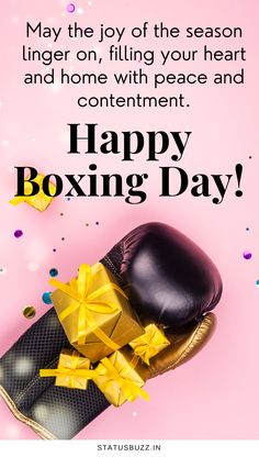 a pair of boxing gloves with yellow bows on it and the words happy boxing day