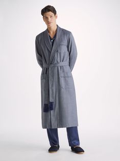 A free time staple, our Lincoln men's wool dressing gown features a classic shawl collar, a breast pocket and two front pockets for practicality while around the house. It's fastened with a tasselled belt for the perfect fit. Made from fine grade worsted wool, this luxury wool dressing gown ensures warmth, comfort and durability without being heavy or bulky. A must-have for the colder months, it looks great over our classic Basel men's t-shirt or combined with a pair of our luxury men's pyjamas Lounge Wear Men, Mens Dressing Gown, Dressing Gowns, Night Cap, Striped Sleeve, Dressing Gown, Mens Pajamas, Wool Fabric, Free Time