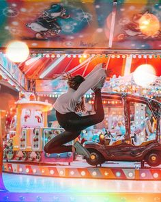 a woman is doing tricks on a carnival ride