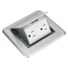 an electrical outlet in the middle of a square metal plate with two outlets on each side