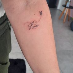 a woman's arm with a tattoo that says luna on the back of her arm