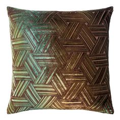 a green and brown pillow on a white background