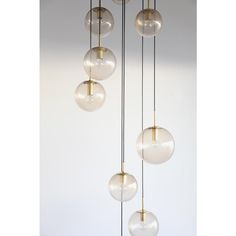 five glass globes hanging from the ceiling