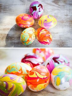 an assortment of painted eggs sitting on top of a wooden table