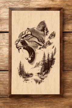 an animal carved into wood with mountains and trees in the background, on a wooden surface