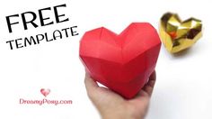 a hand holding a red heart shaped origami box with the text free template