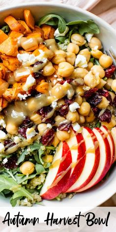 an autumn harvest bowl with apples, chickpeas and spinach