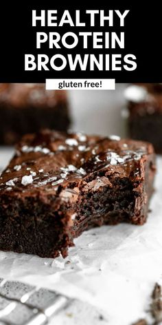 chocolate brownies with coconut flakes on top and text overlay that reads healthy protein brownies gluten free