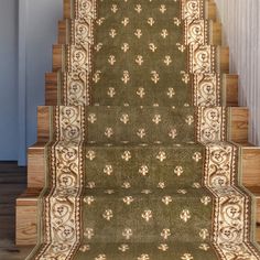 a carpeted stair case with floral designs on it