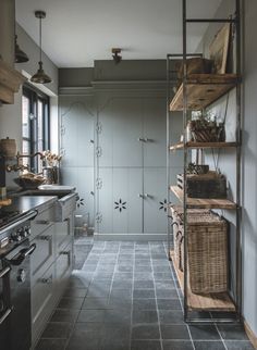 the kitchen is clean and ready for us to use it's shelves are made out of wood