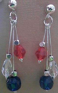 two pairs of earrings with red, blue and green beads hanging from silver earwires