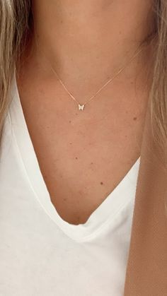 "14K Yellow Gold Butterfly Necklace 16\"+2, Dainty Butterfly Chain, Minimalist Necklace, Layering Necklace, Butterfly Chain ♦ Materials: 14K Yellow Gold, Cubic Zirconia ♦ Available colors: Yellow Gold  ♦ Necklace measurements: 16\" with a 2\" extender, for a total length of 18\". The chain is 1MM wide. The charm is 5MM -------------------------------------------------- ♦ -------------------------------------------------- MATERIALS All chains and pendants are made of 14K Solid Gold  HOW TO FIND YOUR PERFECT FIT Your neck size is probably the most important measurement for determining which necklace length will work best for you. To measure, wrap a soft tape measure around your neck, keeping the tape measure parallel to the floor as you measure. Then, add 2 to 4 inches (5 to 10 cm) to your n Dainty Gold Butterfly Necklace, 14k Gold Butterfly Necklace, Gold Butterfly Necklace, Minimal Pendant, Butterfly Chain, Dainty Butterfly, Butterfly Necklace Gold, Necklace Butterfly