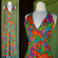 Gorgeous Dress Circa 1970s My estimate is that the fabric is 1970s and the dress may have been made a bit later Vibrant Floral Print in Orange, Pink, Purple, Green with Teal Background Halter Neckline with Hook & Eye to Secure  Open Back V Neckline Gathers Slightly at Bust Peaked Empire Waistline Maxi Length Center Back Zip - Appears to be a more modern hidden style zip **stitching down front left seam shows. bottom hem is hand stitched and slightly inconsistent with different thread colors and stitch styles. not obvious since it is the hem, but please see all photos. dress sold as is No Tags Tag size may not be accurate to current day sizing, please refer to garment's measurements. Garments are measured laying flat - measurements doubled as necessary. Front Bust: 14.5 in (not doubled sinc Retro V-neck Lined Maxi Dress, 1970s Style Multicolor Maxi Dress, Vintage Summer Maxi Dress With Retro Print, Fitted Retro Print Maxi Dress, Retro Lined Maxi Dress, 70s Inspired Fitted Summer Maxi Dress, Fitted 70s Inspired Summer Maxi Dress, 1970s Floral Print Maxi Dress, Retro Vintage Print Maxi Dress For Summer