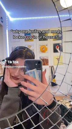 a woman taking a selfie in front of a mirror with the caption'why are knives and meds locked up in our house? '