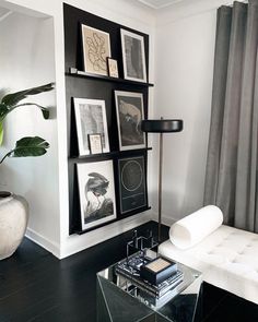 a living room with black and white decor