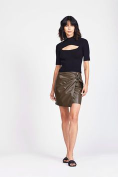 This sweater top features a rib knit design that creates a sculptural effect along the neckline, sleeves, and waist. The neckline and upper back have a perfectly cut-out design that creates the illusion of a tank and shrug styled together. Chic Ribbed Crop Top, Chic Knit Top For Party, Fitted Ribbed Tops For Evening, Fitted Ribbed Evening Tops, Stretch Ribbed Knit Top For Night Out, Chic Knit Top For Fall Evening, Chic Ribbed Fitted Knit Top, Chic Knit Top For Evening In Fall, Chic Evening Knit Top For Fall