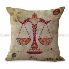 a decorative pillow with an image of a scales on the front and side, which reads libra