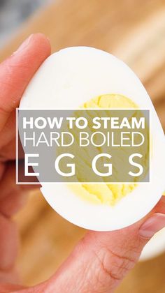 someone holding an egg with the words how to steam hard boiled eggs on it's side