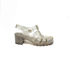 Vintage 1990s clear vinyl iridescent glitter chunky heel jelly sandals by Juju. Features clear vinyl with iridescent glitter uppers, rounded toe, cutout vents at vamp, combo heel/ankle strap with adjustable buckle, thick sole, and chunky block heel. Excellent vintage condition. Made in England.   Heel to toe (inside shoe): 9.875 inches  Ball of foot (bottom of sole): 3.5 inches  Heel height: 2.25 inches  Size 8.5/9 (unmarked, refer to measurements for best fit) Inside Shoes, Jelly Shoes, Chunky Block Heels, Jelly Sandals, Clear Vinyl, 5 Inch Heels, Heeled Sandals, Chunky Heels, Women's Shoes Sandals