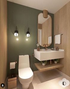 a bathroom with a toilet, sink and green striped wallpaper on the walls is shown