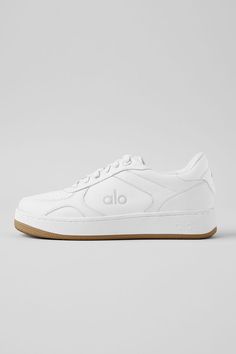 Meet the Alo Recovery Mode Sneaker: The first shoe that’s engineered for performance recovery and designed for a clean, modern, streetwear look. It has a structured, supportive outer sole and a high-rebound foam insole to support balance and pressure points for all-day recovery. Made from cruelty-free vegan leather and recycled components, the revolutionary tech and abrasion-tested rubber ensure that it lasts three times longer than any other street shoe on the market. Bottom line: the Alo Recov 2024 White Sneakers, Alo Sneakers, Alo Shoes, Accolade Sweatpant, Trendy White Sneakers, Cute Golf Outfit, Bar Shoes, Modern Streetwear, Best Walking Shoes