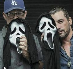 two men with faces painted to look like scream masks