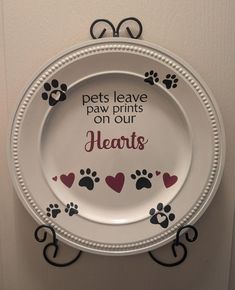 a white plate with paw prints on it