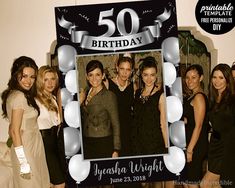 a group of people standing next to each other in front of a birthday photo frame