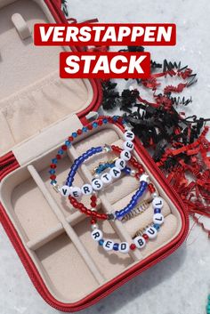 an open red case with two bracelets in it and the words versaappen stack inside