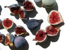 the figs are cut in half and ready to be eaten with their leaves still attached