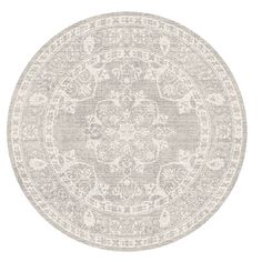 a round rug with an intricate design in grey and white on a white background,