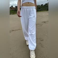 Thick And Cozy Cotton Blend Sweatpants With An Elastic Waistband, Side Pockets, And Elastic Cuffs. Fabrics: 82% Cotton, 18% Polyester Measurements: 10" (25 Cm) Rise, 27" (69 Cm) Inseam, 24" (61 Cm) Waist (Stretches) Made In: China Basic White Cotton Bottoms, White Full Length Sweatpants For Loungewear, White Relaxed Fit Leisure Bottoms, White Relaxed Fit Bottoms For Leisure, White Cotton Leisure Pants, White Leisure Long Pants, White Long Pants For Leisure, White Fitted Leisure Bottoms, Basic White Bottoms With Pockets