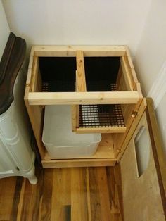 a wooden shelf with two bins on top of it