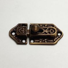 an antique brass plated door handle on a white background