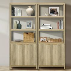 a book shelf with books and pictures on it