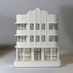 a tall white building sitting on top of a table