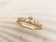 a gold ring with a crown on it