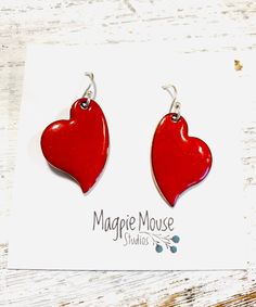 Heart Earrings ~ Red Enamel Minimalist Asymmetrical Heart Drop Earrings by MagpieMouseStudios on Etsy https://www.etsy.com/listing/750341562/heart-earrings-red-enamel-minimalist Heart Charm Enamel Earrings, Heart-shaped Enamel Earrings With Charm, Valentine's Day Heart Charm Enamel Earrings, Handmade Heart-shaped Enamel Earrings, Red Teardrop Earrings For Valentine's Day, Valentine's Day Enamel Dangle Earrings, Enamel Heart Charm Earrings As Gift, Enamel Earrings With Heart Charm As Gift, Red Nickel-free Dangle Heart Earrings