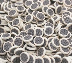 a pile of black and white buttons sitting on top of each other