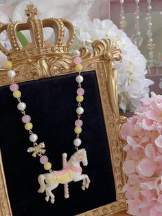 This exquisitely crafted necklace features a charming carousel pendant, adorned with pastel hues and intricate details that capture the essence of kawaii and Lolita aesthetics. The delicate chain complements the pendant, adding a touch of sweetness to any outfit.  Please note that this product includes only one necklace. Kawaii Jewelry Aesthetic, Clay Coquette, Chocolate Rings, Pastel Clothing, Kawaii Necklace, Pink Choker, Random Fashion, Chocolate Design, Pink Chocolate