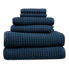 four towels stacked on top of each other in dark blue color, one folded and the other rolled up