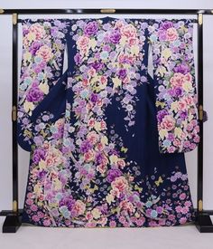 This vintage Japanese silk Furisode Kimono will cover you with a flowers.  Wear this long sleeve robe to your special event or display it in your home. Item: Furisode Silk Kimono No. frn238 Size: US L   /  Length 65.7 inch (167cm), Width 27.5 inch (70cm). Condition: Used, Very Good. Please check the photos. Need a KIMONO RACK to hang this kimono?  Find it here: https://www.etsy.com/listing/1303669853/kimono-rack-japanese-kimono-display-rack Shop the entire collection https://fujiyamarock.etsy.co Kimono Display, Traditional Blue Festive Kimono, Elegant Blue Floral Print Kimono, Luxury Blue Silk Kimono, Long Kimono Dress, Blue Printed Silk Kimono, Furisode Kimono, Japanese Furisode Kimono, Blue Kimono