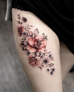 a woman's thigh with flowers on it