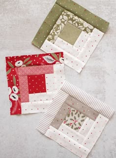 three quilted placemats sitting next to each other