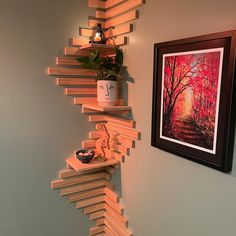 a staircase made out of wooden planks in the corner of a room next to a painting