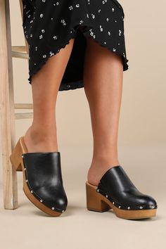 Step into the cutest style of the season with the Lulus Romain Black Studded Platform Clogs! These wardrobe-essential clogs have a smooth, faux leather construction that shapes a rounded toe and a classic curved topline (with an elastic gusset at the instep). Silver mirrored studs lends a hint of shine along the wood-look heel that carries into a 1"" toe platform. 3" wood-look block heel. Smooth insole. Rubber sole has nonskid markings. Man made materials. Imported. Lulus | Romain Black Studded Platform Clogs | Size 5.5. Platform Clogs, Clog Heels, Leather Clogs, Silver Mirrors, Pump Shoes, The Cutest, Wardrobe Essentials, Block Heels, Apparel Accessories