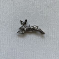 "Leaping hare pendant is a hand carved sterling silver jewelry piece. Hares always fascinated humankind, they played important parts in mythology, folklore and literature. These animals are imprinted in our subconsciousness as mysterious and wise creatures in pastoral wilderness like a scene from a medieval tapestry. They were sacred to pagans, witches, to cunning folk. They were associated with moon and spring and goddess Ostara (Easter). Artists, authors, poets dreamt and depicted these enigma Goddess Ostara, Kit Williams, Cunning Folk, Folklore Mythology, Leaping Hare, Rabbit Jewelry, Surreal Scenes, Medieval Tapestry, Pagan Art