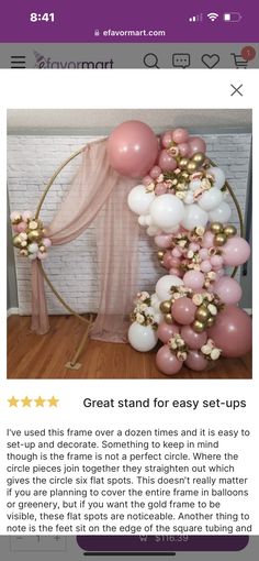 a pink and gold balloon arch with balloons